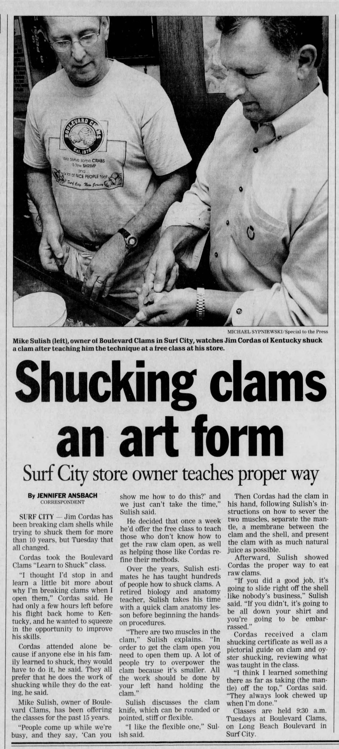 Newspaper clipping of Jennifer Ansbach's article
"Shucking Clams an Art Form: Surf City Store Owner Teaches Proper Way," published in the Asbury Park Press, July 18, 2002.