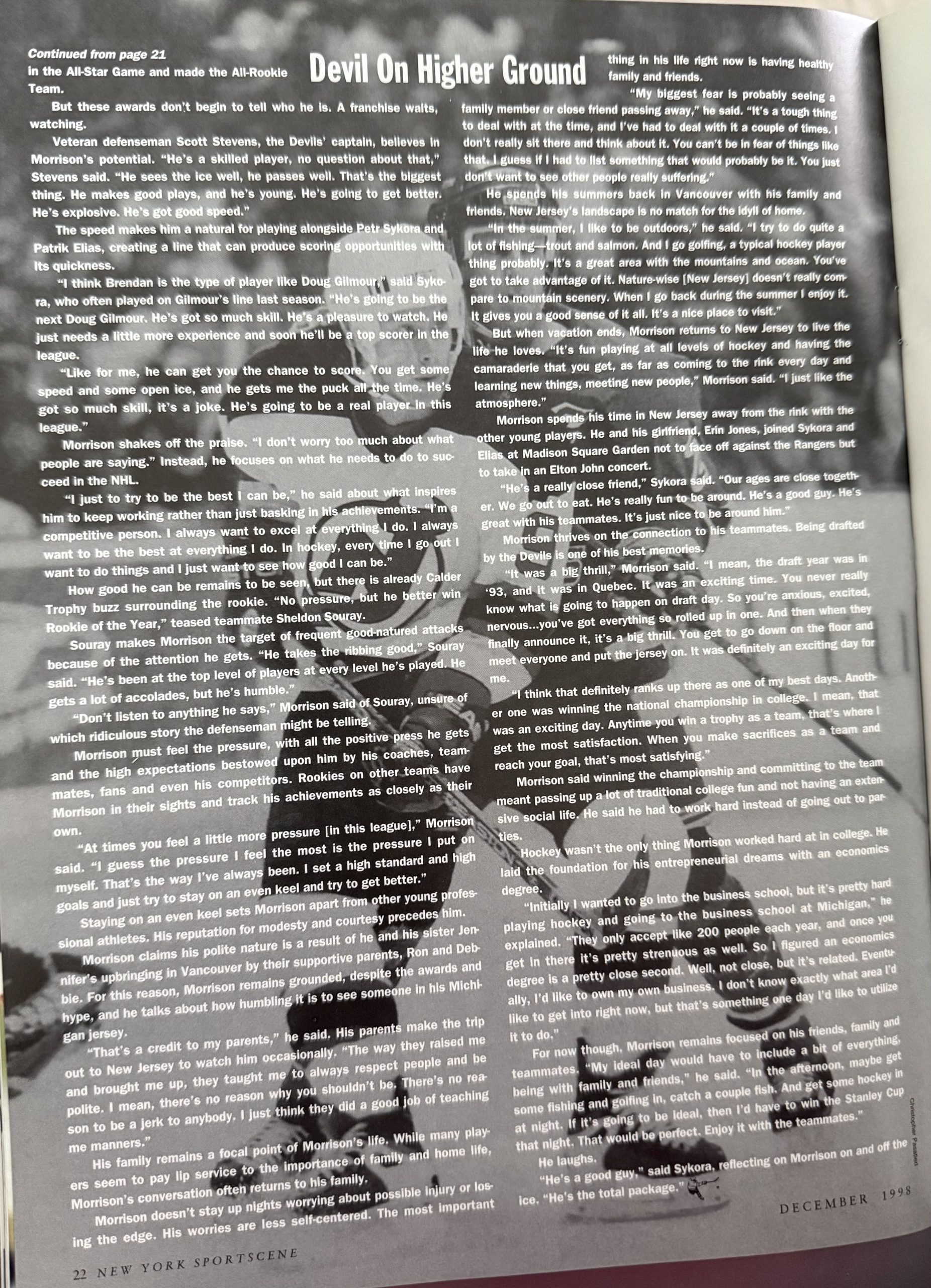 Article continues with image of Morrison in the background